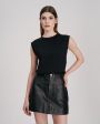Кожаная юбка мини в стиле 70-х, цвет черный - миниатюра 2